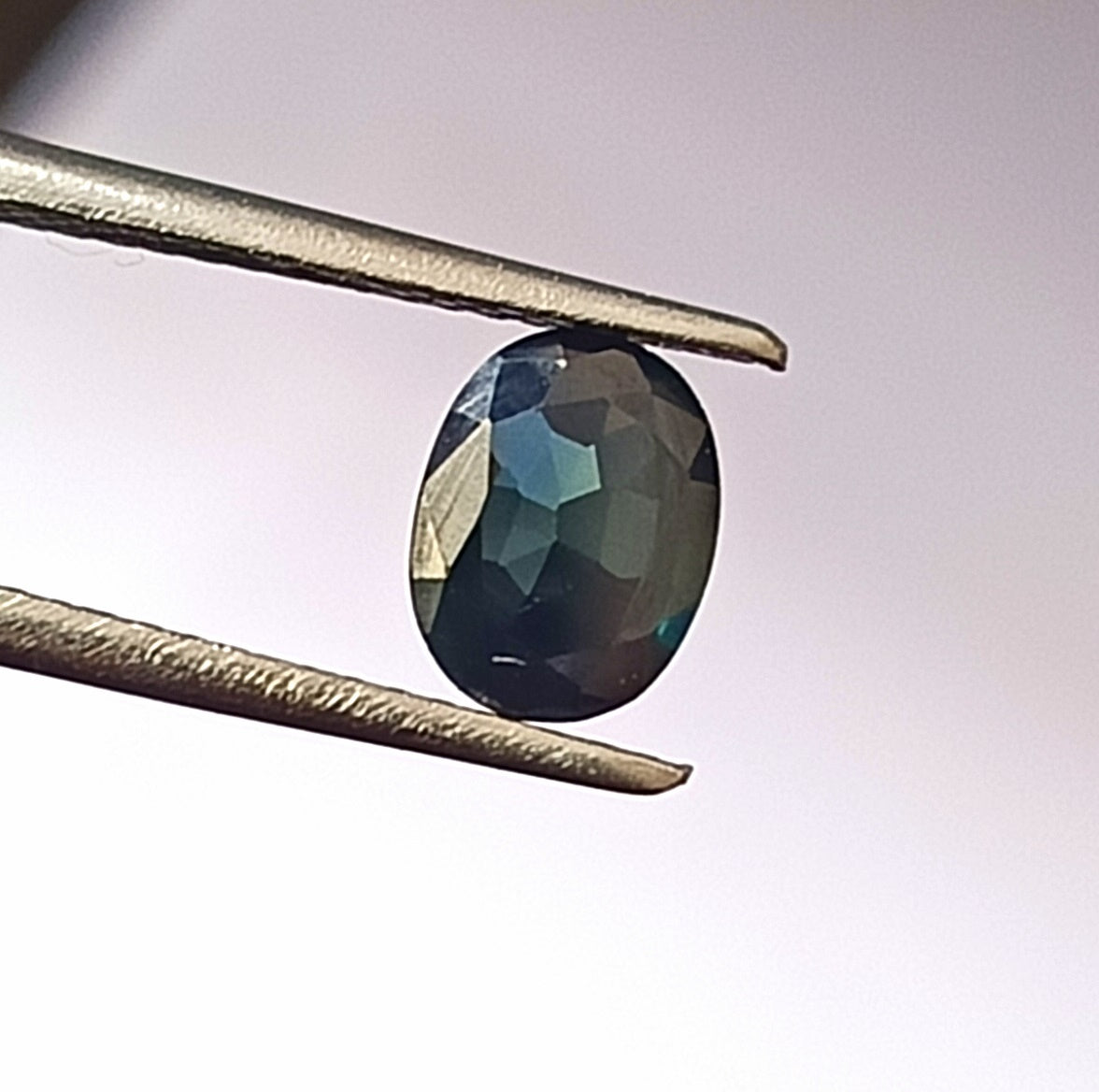 0.90 Carat 5.5X7.2X2.4 (WXLXD) Natural Unheated Oval Shaped Australian Green Sapphire