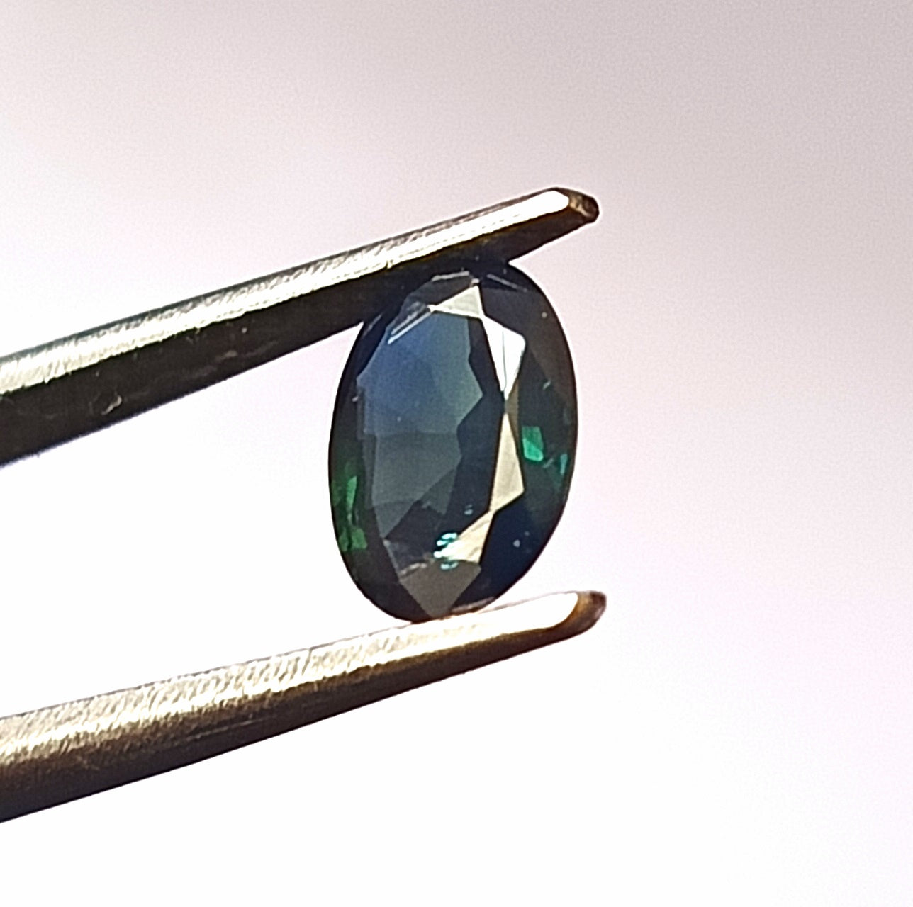 0.90 Carat 5.5X7.2X2.4 (WXLXD) Natural Unheated Oval Shaped Australian Green Sapphire