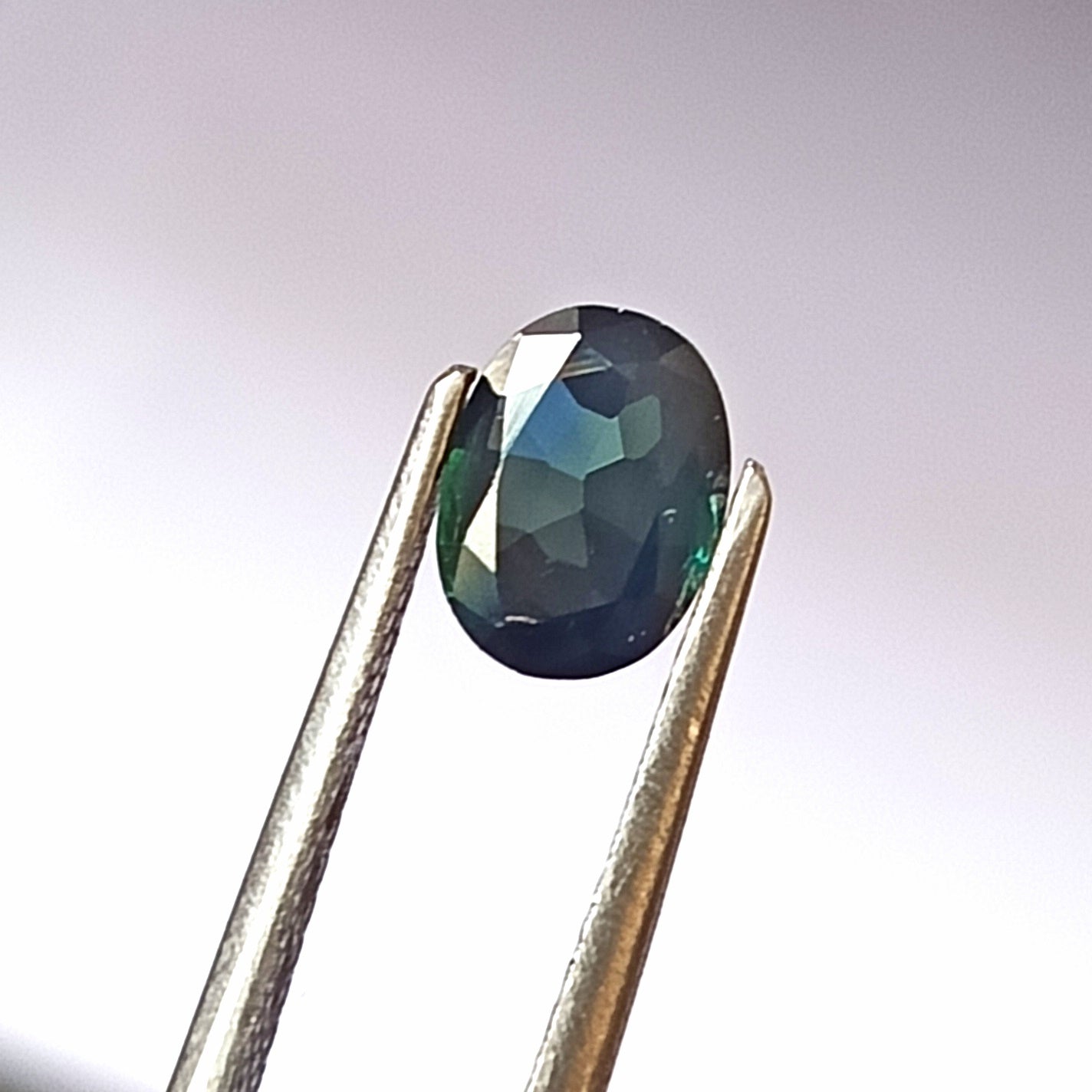 0.90 Carat 5.5X7.2X2.4 (WXLXD) Natural Unheated Oval Shaped Australian Green Sapphire